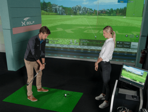 X-Golf Coach Giving Player a Golf Lesson