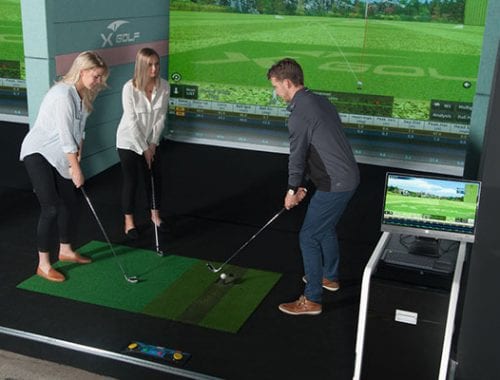 X-Golf Professional Giving Lessons to Female Players