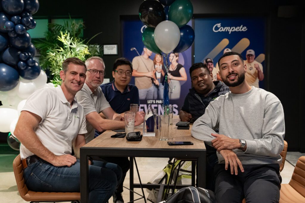 Group of men posing for a photo at the X-Golf Morley venue