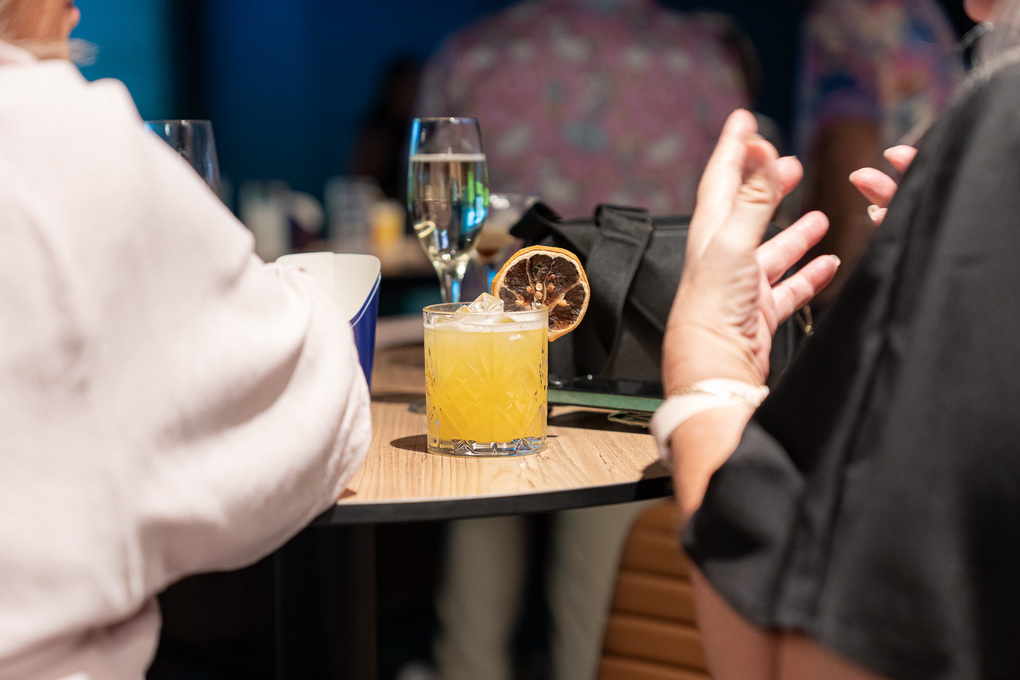 Cocktail and conversation at X-Golf Morley bar setting