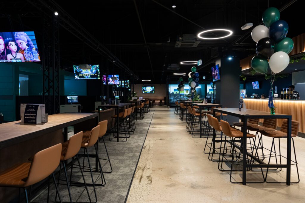 Lounge seating area inside X-Golf Morley entertainment venue