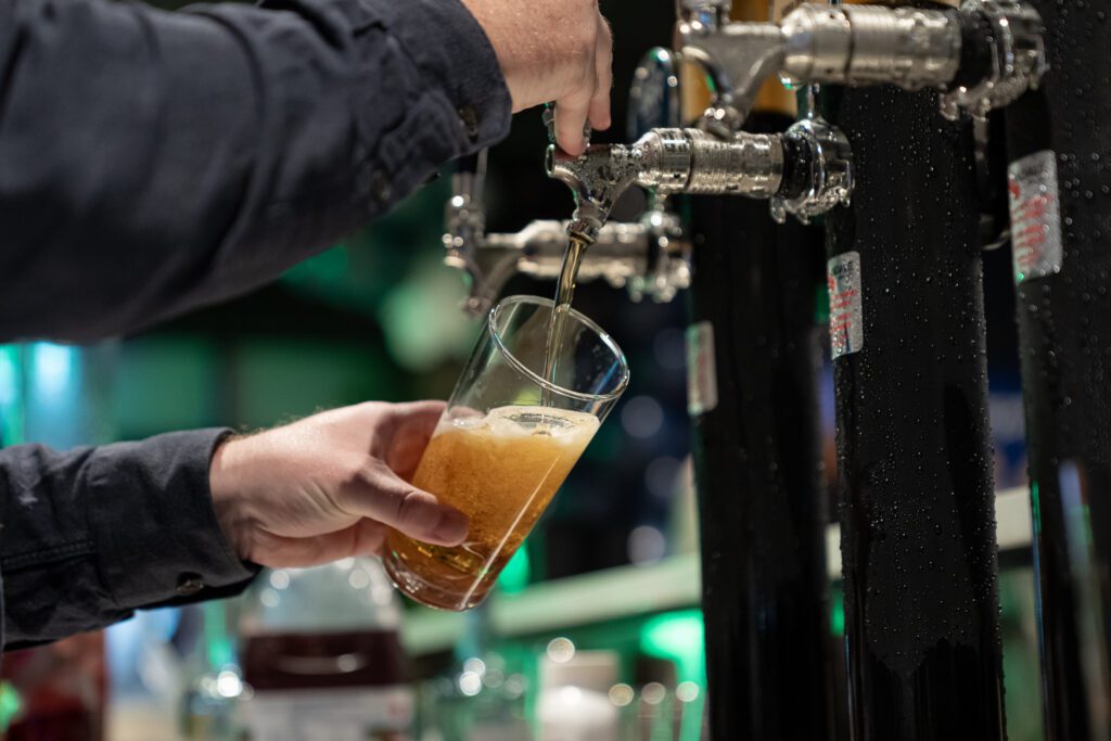 Beer poured from tap at X-Golf Morley bar