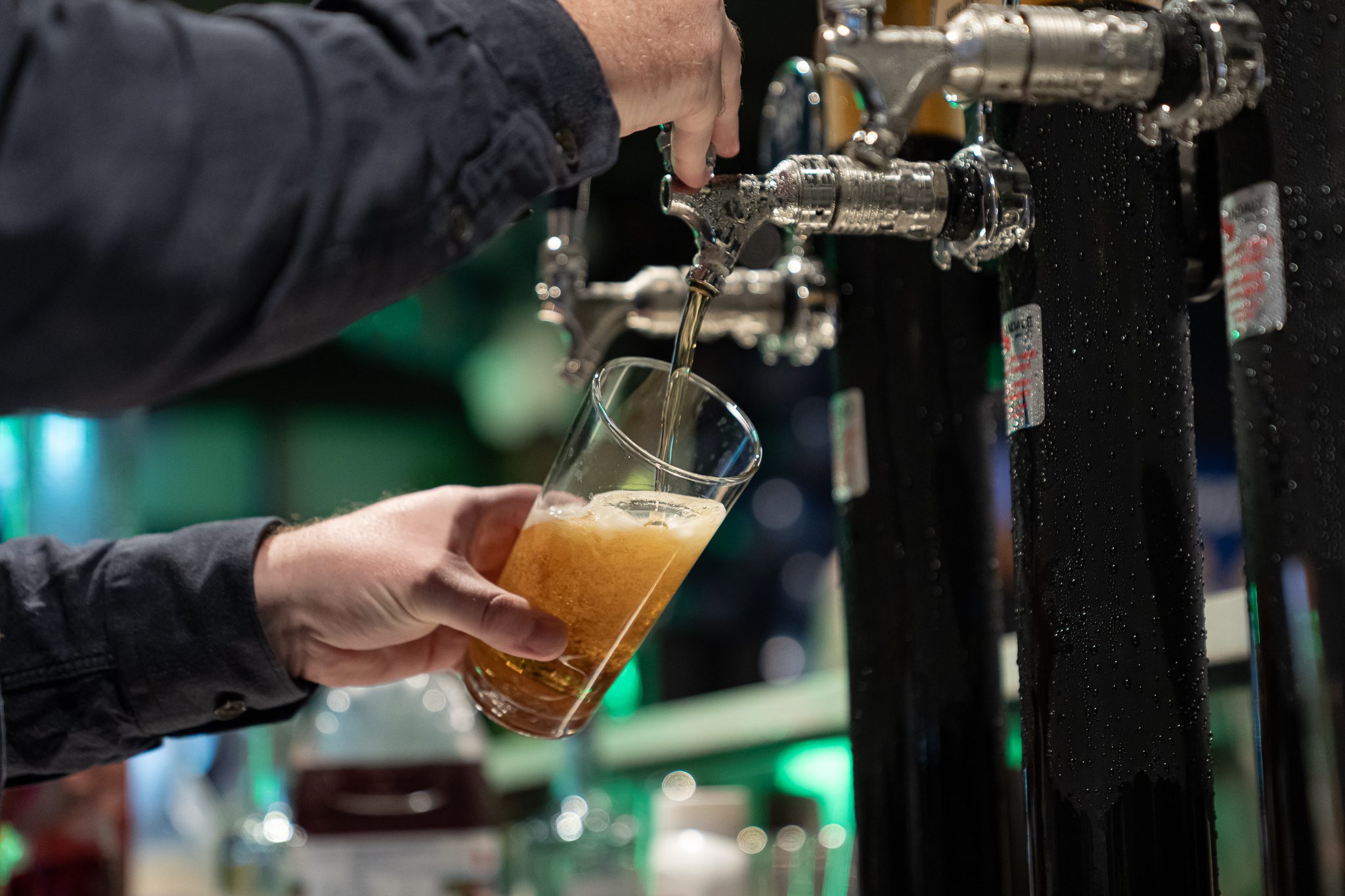 Beer poured from tap at X-Golf Morley bar